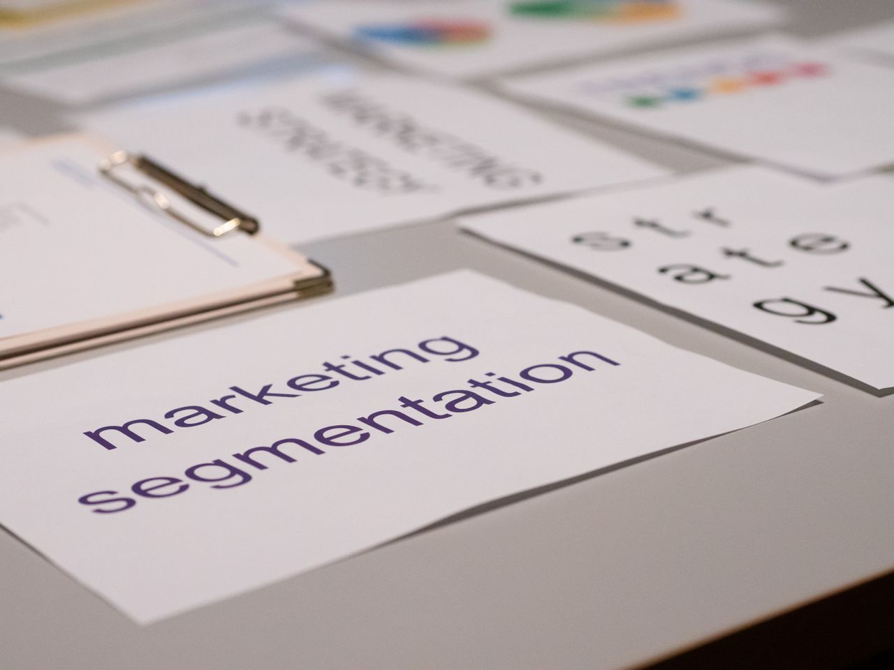 services-06 Close-up of various marketing documents on a desk, perfect for business and strategy discussions.